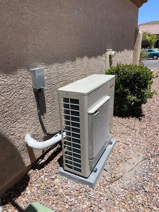 Residential air conditioning condenser unit in West Point